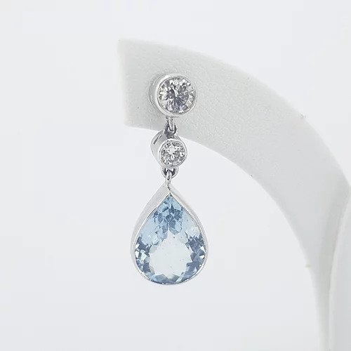 Pear Shaped Aquamarine and Diamond Drop Earrings; 4.00cts pear-cut aquamarines suspended from 0.66cts graduated brilliant-cut diamonds, in 18ct white gold