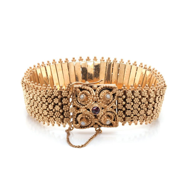 Gold bracelet with gemstone clasp