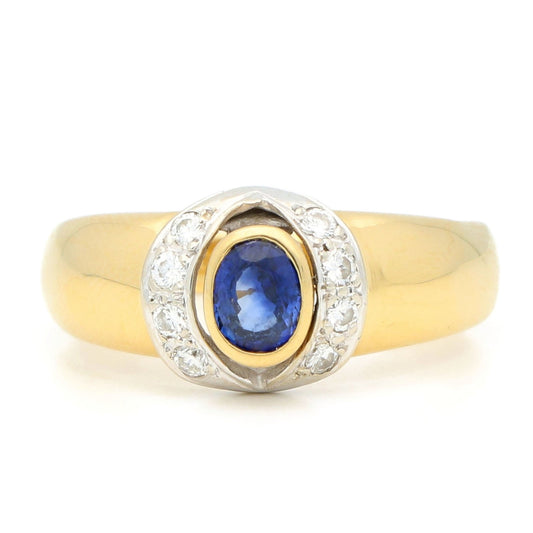 A sapphire and diamond ring in yellow and white gold