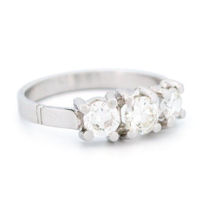 A three stone round diamond ring claw set in platinum