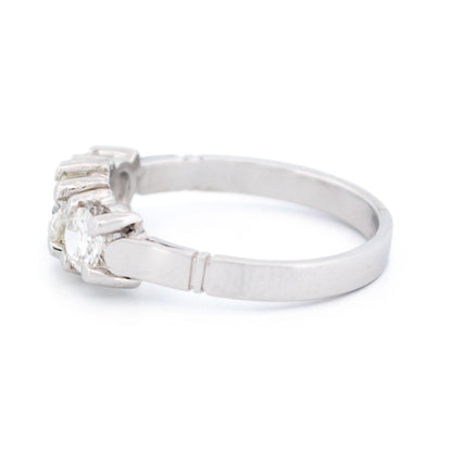 A three stone round diamond ring claw set in platinum