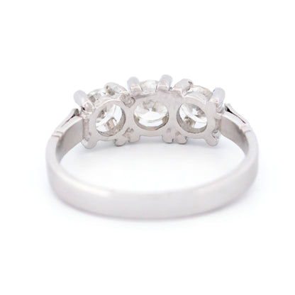 A three stone round diamond ring claw set in platinum