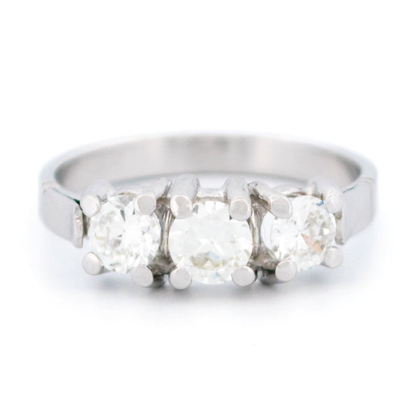 A three stone round diamond ring claw set in platinum