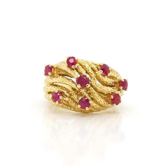 Vintage Ruby and 18ct Yellow Gold Rope Effect Ring; A rope effect ring, set with eight rubies and crafted from 18ct yellow gold. Circa 1950. Ring size L.
