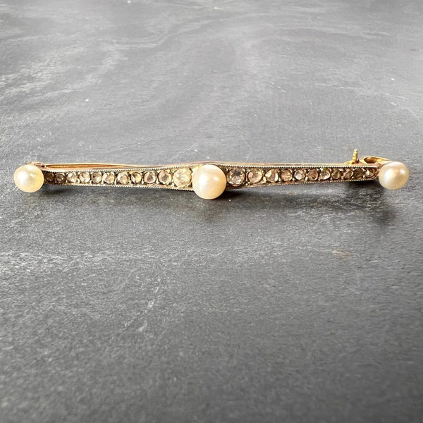 Antique Natural Pearl and Rose Cut Diamond Bar Brooch, set with three button-shape natural white pearls interspaced by 20 rose-cut and two old-cut diamonds in silver upon 18ct yellow gold