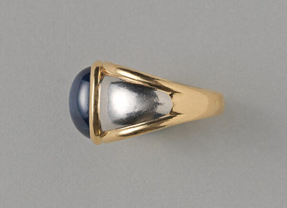 Vintage 11.87ct Cabochon Sapphire, Gold and Platinum Dress Ring; set with an oval cabochon-cut 11.87 carat natural untreated sapphire. France