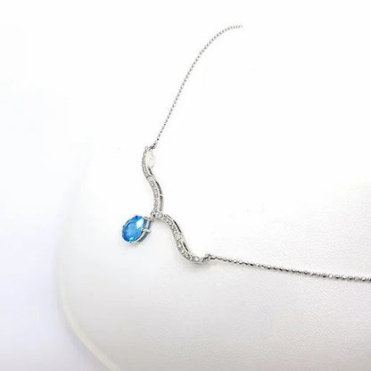 Blue Topaz and Diamond Articulated Illusions Pendant Necklace; with moveable diamond set sections to wear either as a cluster pendant or a drop necklace, in 18ct white gold