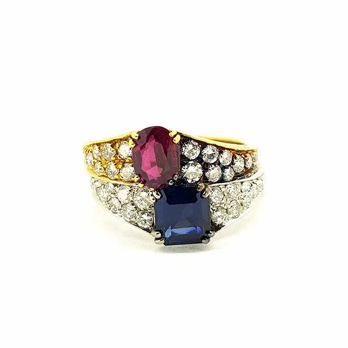 Vintage Ruby, Sapphire and Diamond Bi-Colour Gold Ring; 18ct yellow gold band set with oval-cut ruby flanked by diamonds, and 18ct white gold band set with asscher-cut sapphire and diamonds, Circa 1970