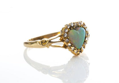 Antique Victorian Opal and Rose Cut Diamond Heart Cluster Ring; 0.75ct heart shaped opal surrounded by 0.36cts rose cut diamonds, 18ct yellow gold, Circa 1865