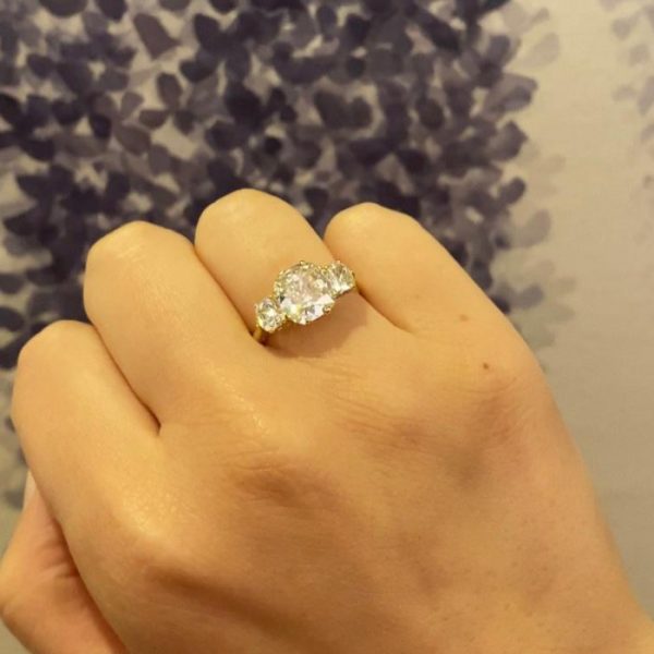 3.13ct Cushion Cut Diamond Three Stone Ring; cushion-cut diamond flanked by round old-cut diamonds, 18ct yellow gold, with GIA certificate