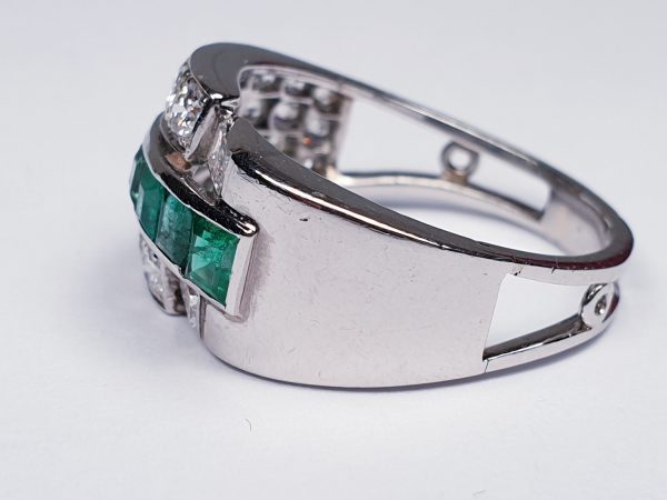 Vintage Emerald and Diamond Asymmetric Geometric Band Ring; set with 0.70cts graduated square step-cut emeralds encompassed by an asymmetric 1.40cts diamond surround. Mounted in Platinum and 18ct White Gold. Circa 1940s