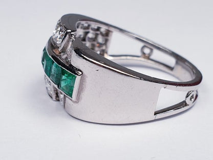 Vintage Emerald and Diamond Asymmetric Geometric Band Ring; set with 0.70cts graduated square step-cut emeralds encompassed by an asymmetric 1.40cts diamond surround. Mounted in Platinum and 18ct White Gold. Circa 1940s