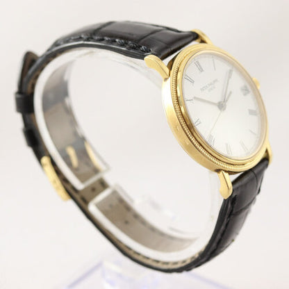 Patek Philippe 3802 Calatrava 18ct Yellow Gold 33mm Automatic, porcelain white dial, Roman numerals, date indicator at 3, calibre 310SC, Patek Phillipe black leather strap with 18ct Yellow Gold buckle, Circa 1991, in mint condition, with Patek Philippe pouch and papers.