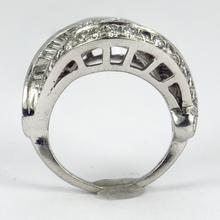 Retro Diamond and Platinum Cocktail Ring; designed as a dome with curved and flaring ridges, set with 2.55 carats round brilliant cut and baguette diamonds