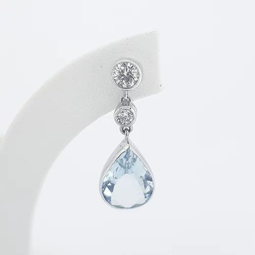 Pear Shaped Aquamarine and Diamond Drop Earrings; 4.00cts pear-cut aquamarines suspended from 0.66cts graduated brilliant-cut diamonds, in 18ct white gold