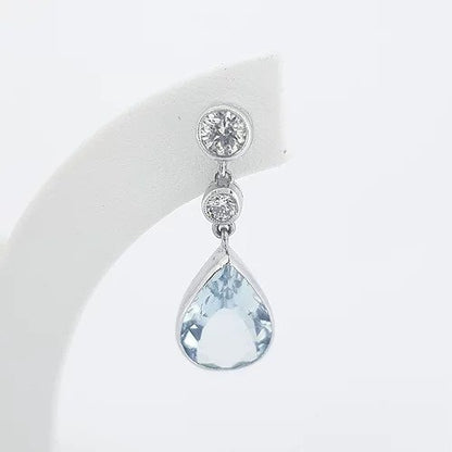 Pear Shaped Aquamarine and Diamond Drop Earrings; 4.00cts pear-cut aquamarines suspended from 0.66cts graduated brilliant-cut diamonds, in 18ct white gold
