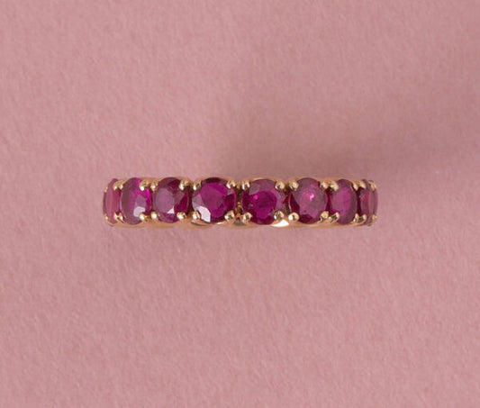 French Ruby Full Eternity Ring in 18ct Yellow Gold; set with seventeen round facetted natural heated rubies, 2.89 carat total. Made in France