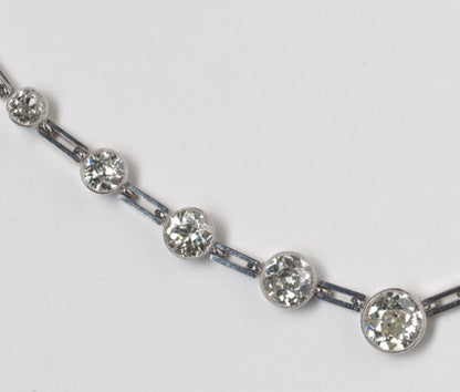 Art Deco Graduated Old Cut Diamond Necklace, 10 carats, thirty-two old-cut diamonds, collet-set with millegrain border, gate-bar links, 18ct white gold.