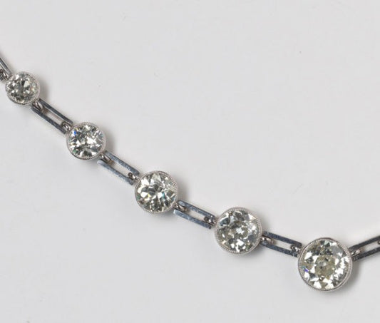 Art Deco Graduated Old Cut Diamond Necklace, 10 carats, thirty-two old-cut diamonds, collet-set with millegrain border, gate-bar links, 18ct white gold.