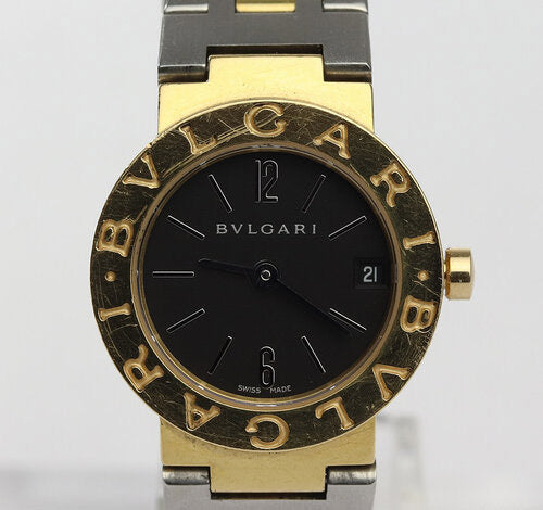 Bvlgari Ladies 18ct Yellow Gold and Steel 23mm Quartz Watch; black dial, date indicator and sapphire crystal, on Steel and gold bracelet with fold over clasp