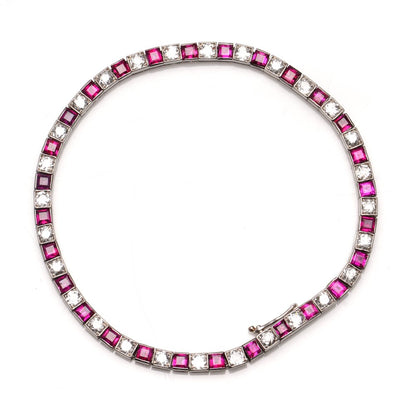 Cartier Art Deco Ruby and Diamond Line Bracelet; with 3.50cts princess-cut rubies and 1.96cts old European-cut diamonds in platinum, Comes with GCS certificate and original Cartier box. Made in France, Paris, 1920s