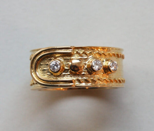 Kutchinsky Vintage Diamond and 18ct Yellow Gold Buckle Ring; geometrical and wave pattern, four buttons of which three are set with diamonds. Signed Kutchinsky, London, 1969