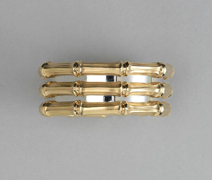 Cartier Bi-Colour 18ct Gold Bamboo Cuff Bangle Bracelet; designed as three rows of 18ct yellow gold bamboo motifs, held together by a white gold backing. Signed and numbered Cartier, 640927