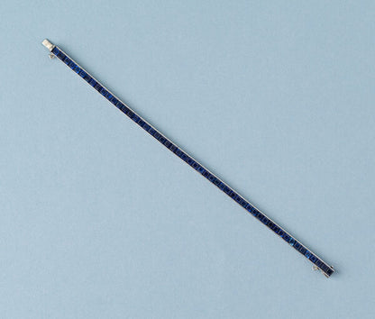 Tiffany and Co Platinum and Sapphire Line Bracelet, 20 carat total, set with 52 carré cut sapphires, Signed Tiffany & Co., Circa 1950