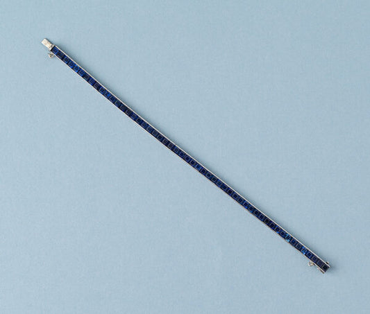 Tiffany and Co Platinum and Sapphire Line Bracelet, 20 carat total, set with 52 carré cut sapphires, Signed Tiffany & Co., Circa 1950