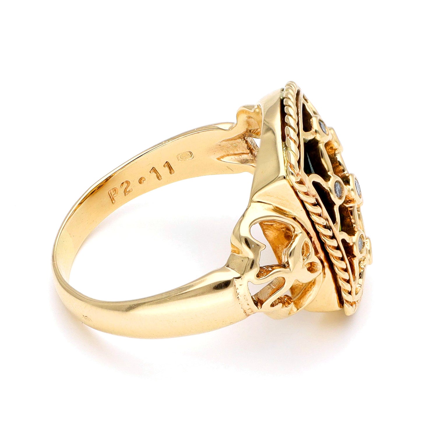 A yellow gold ring with green enamel and round diamonds set into a trellis design, against a white background