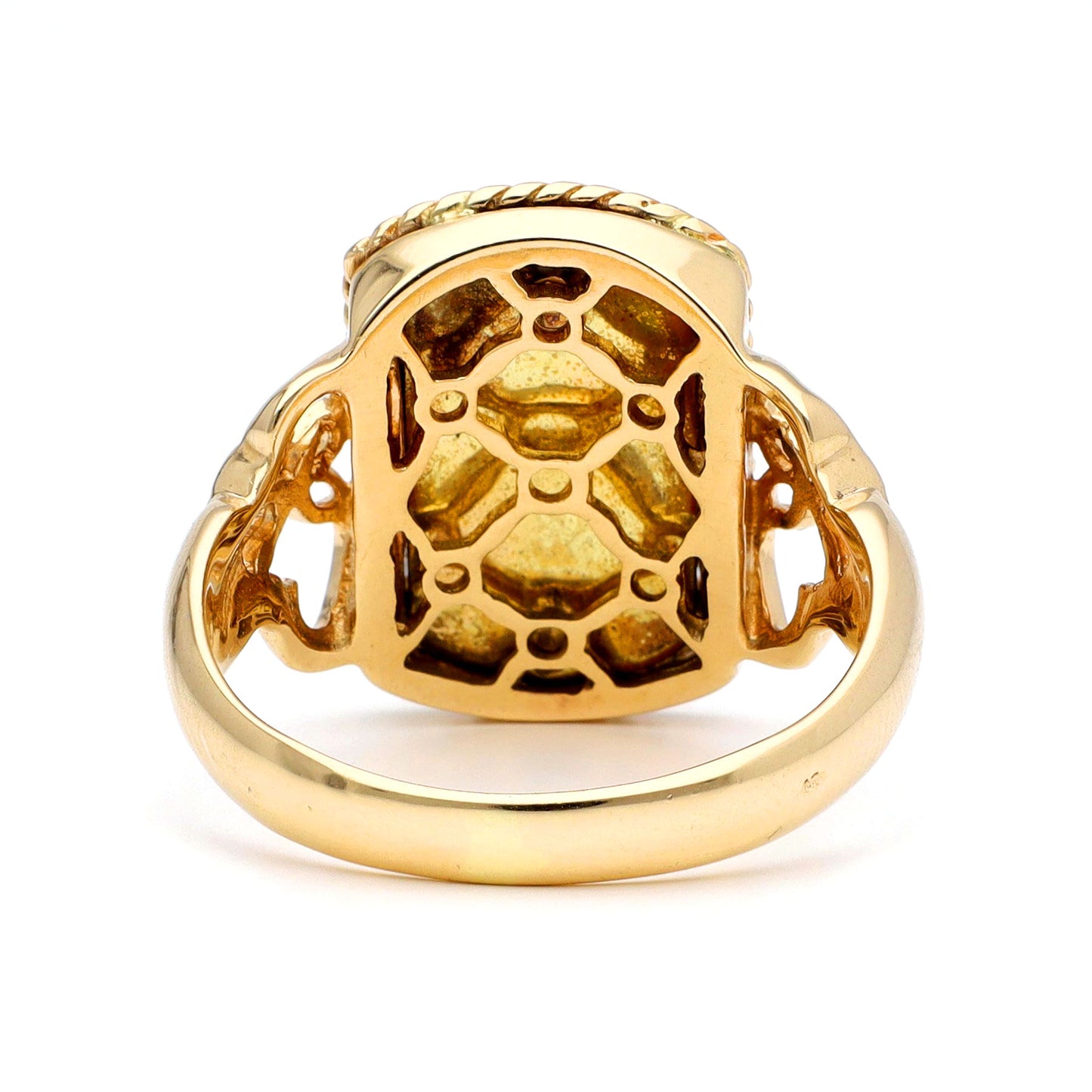 A yellow gold ring with a trellis design, against a white background