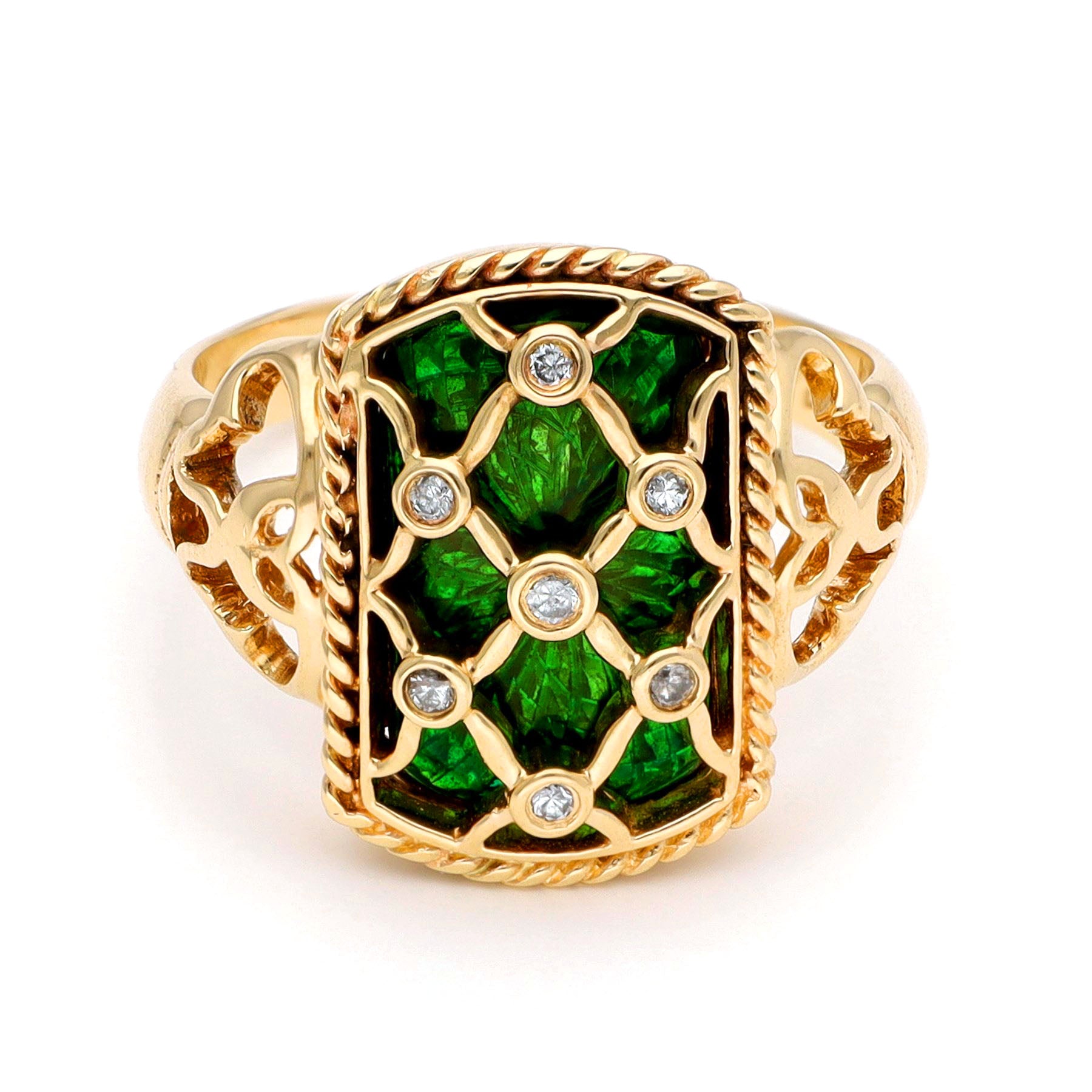 A yellow gold ring with green enamel and round diamonds set into a trellis design, against a white background