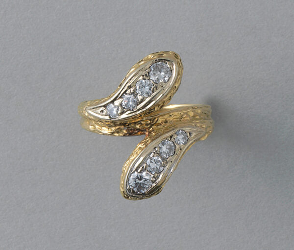 Vintage Diamond and 18ct Yellow Gold Snake Ring; two snake heads set with graduating brilliant diamonds, scaly structure to shank, France, Circa 1970. Attributed to Van Cleef & Arpels