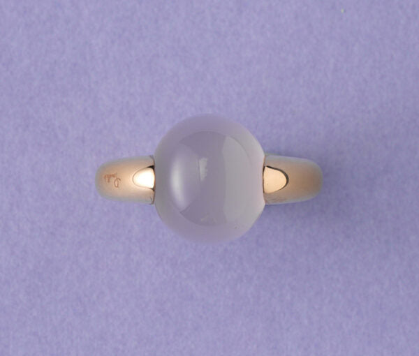 Contemporary Chalcedon and 18ct Gold Luna Ring; set with a cabochon cut oval chalcedon, in 18ct rose gold, Signed and numbered: Pomellato C260026575