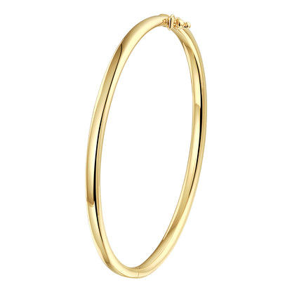 A yellow gold bangle bracelet, against a white background