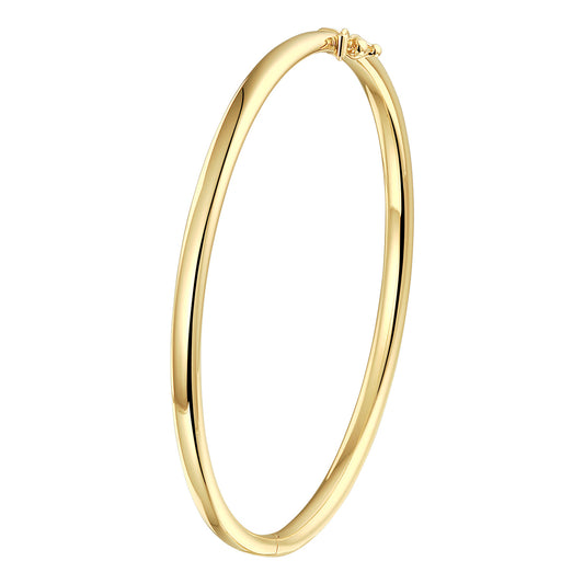 A yellow gold bangle bracelet, against a white background