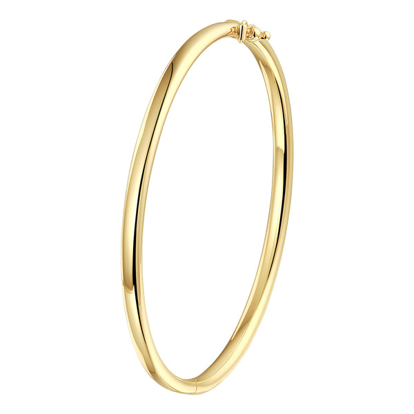A yellow gold bangle bracelet, against a white background