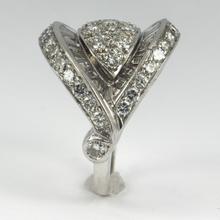Retro Diamond and Platinum Cocktail Ring; designed as a dome with curved and flaring ridges, set with 2.55 carats round brilliant cut and baguette diamonds