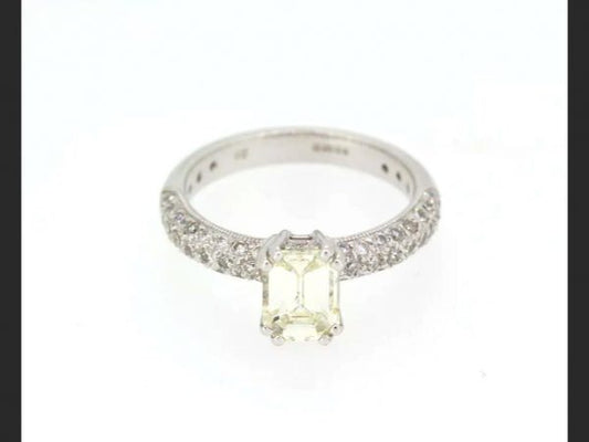 Emerald Cut Diamond Ring; Central emerald cut 1.00 carat diamond, with pave set shoulders totaling 0.55 carats, Hallmarked 18ct white gold