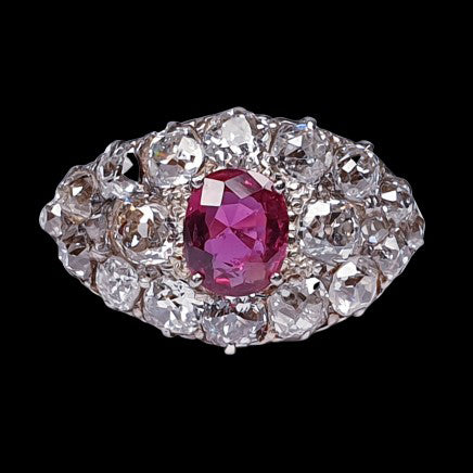 Victorian Antique 1.25ct Siamese Ruby and 3ct Old Mine Cut Diamond Domed Navette Cluster Dress Ring in 18ct yellow gold. Circa 1890