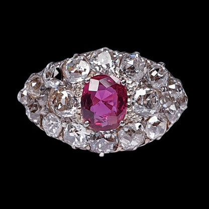 Victorian Antique 1.25ct Siamese Ruby and 3ct Old Mine Cut Diamond Domed Navette Cluster Dress Ring in 18ct yellow gold. Circa 1890