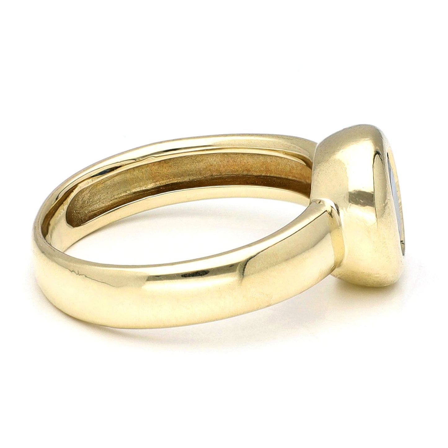 Yellow gold ring, against a white background