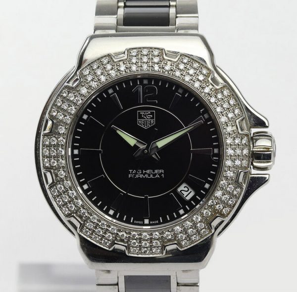 Tag Heuer Formula 1 Ladies Sparkling Diamonds Quartz Watch; Ref WAH1214-0, 36mm stainless steel case with black dial, date indicator, original diamond bezel and sapphire crystal, on a ceramic and stainless steel bracelet with push button clasp