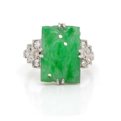 Art Deco Jade and Diamond Dress Ring; pierced carved rectangular piece of jadeite with stepped 0.40ct diamond-set shoulders, in platinum and 18ct white gold, Circa 1920