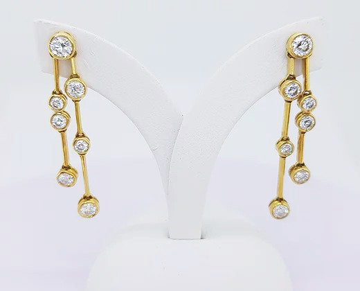 Contemporary Diamond Drop Earrings, 1.40 carat total, colour G, brilliant cut diamonds collet set in 18ct yellow gold, with 18ct gold links