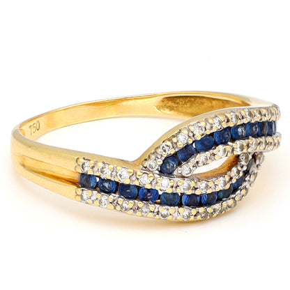 A sapphire and diamond crossover band ring in yellow gold