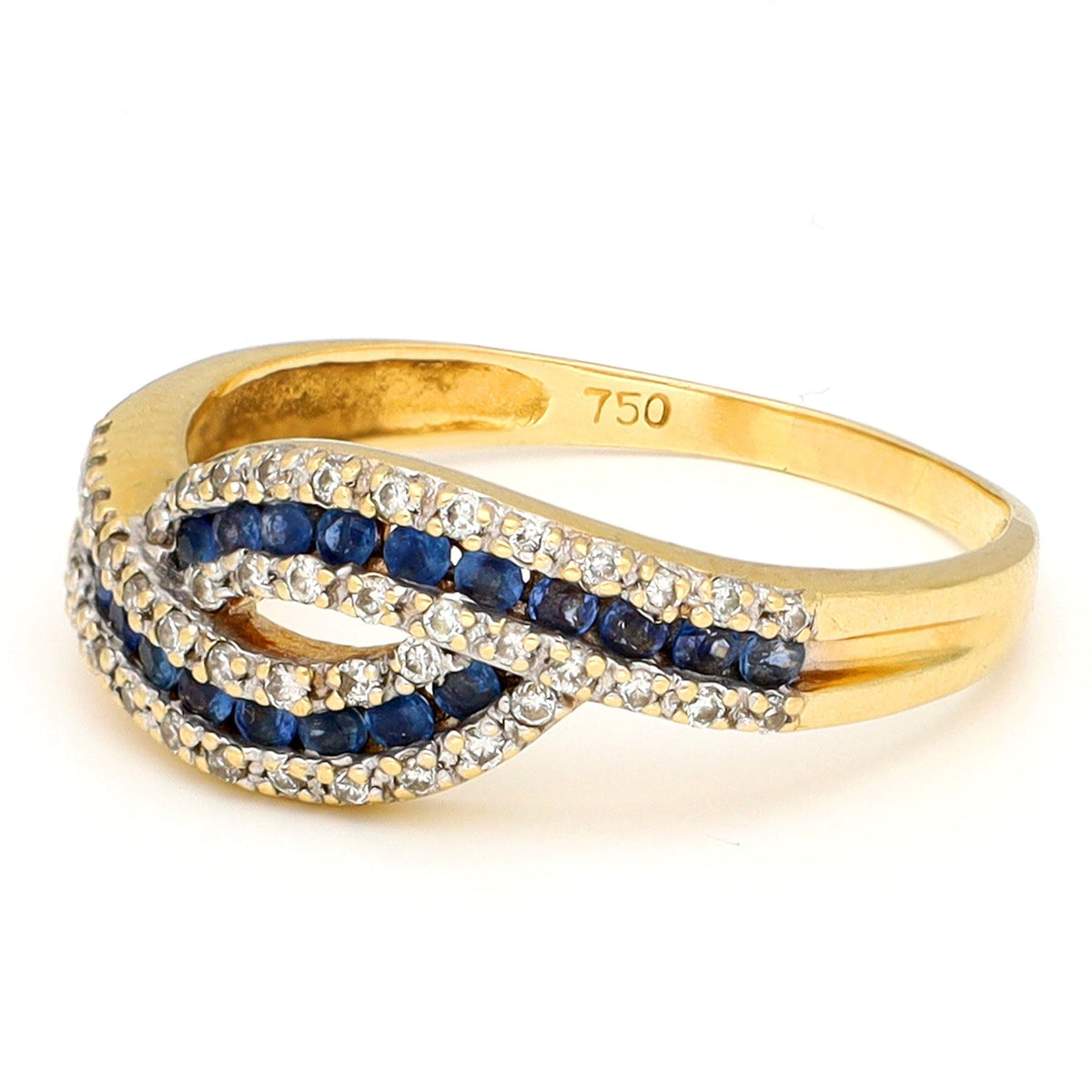 A sapphire and diamond crossover band ring in yellow gold