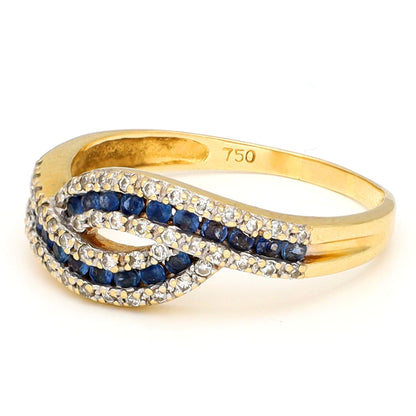 A sapphire and diamond crossover band ring in yellow gold