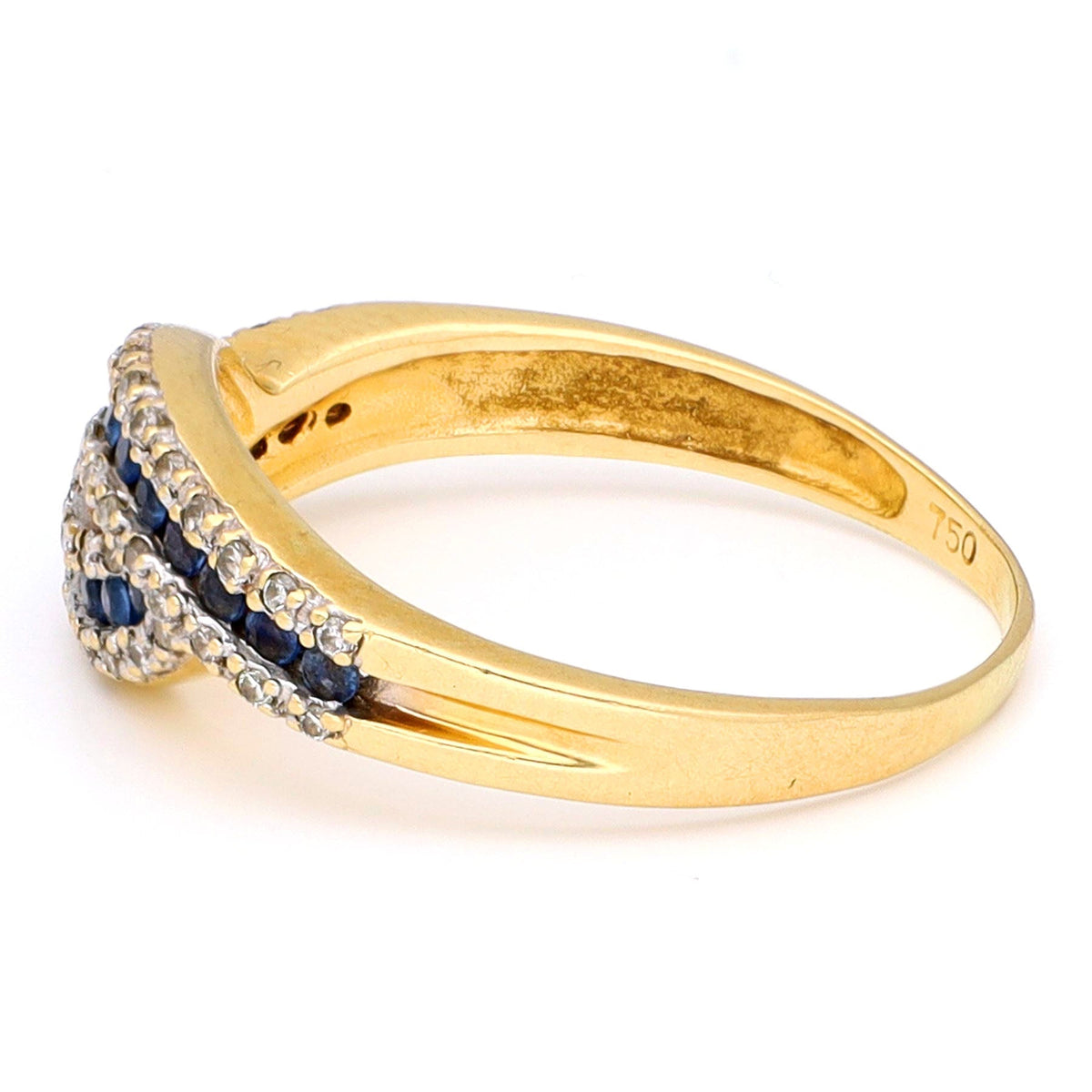 A sapphire and diamond crossover band ring in yellow gold