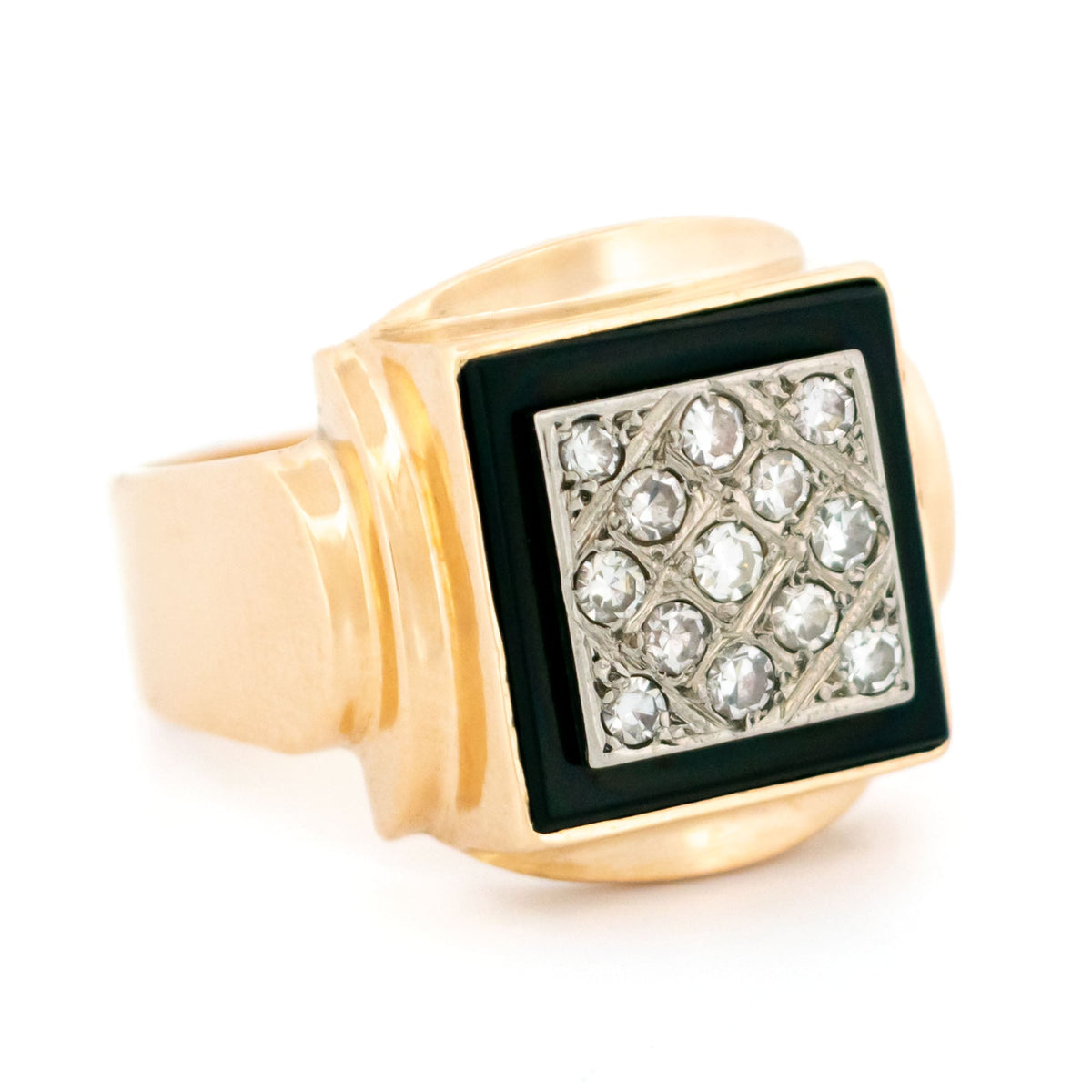 A yellow and white gold signet style ring with a square panel of black onyx and round diamonds